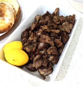 Pan fried Pork in a serving dish with lemon