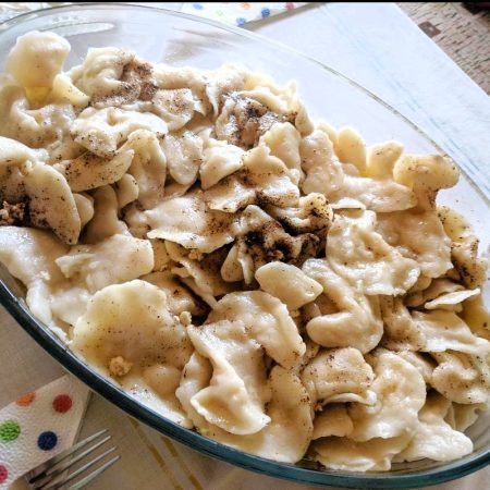 A Plate of Pontian Varenika Cheese-Filled Dumplings on a table