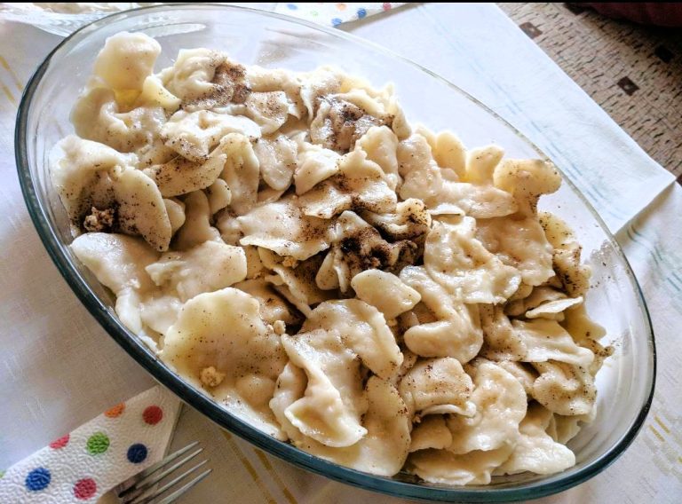 A Plate of Pontian Varenika Cheese-Filled Dumplings on a table