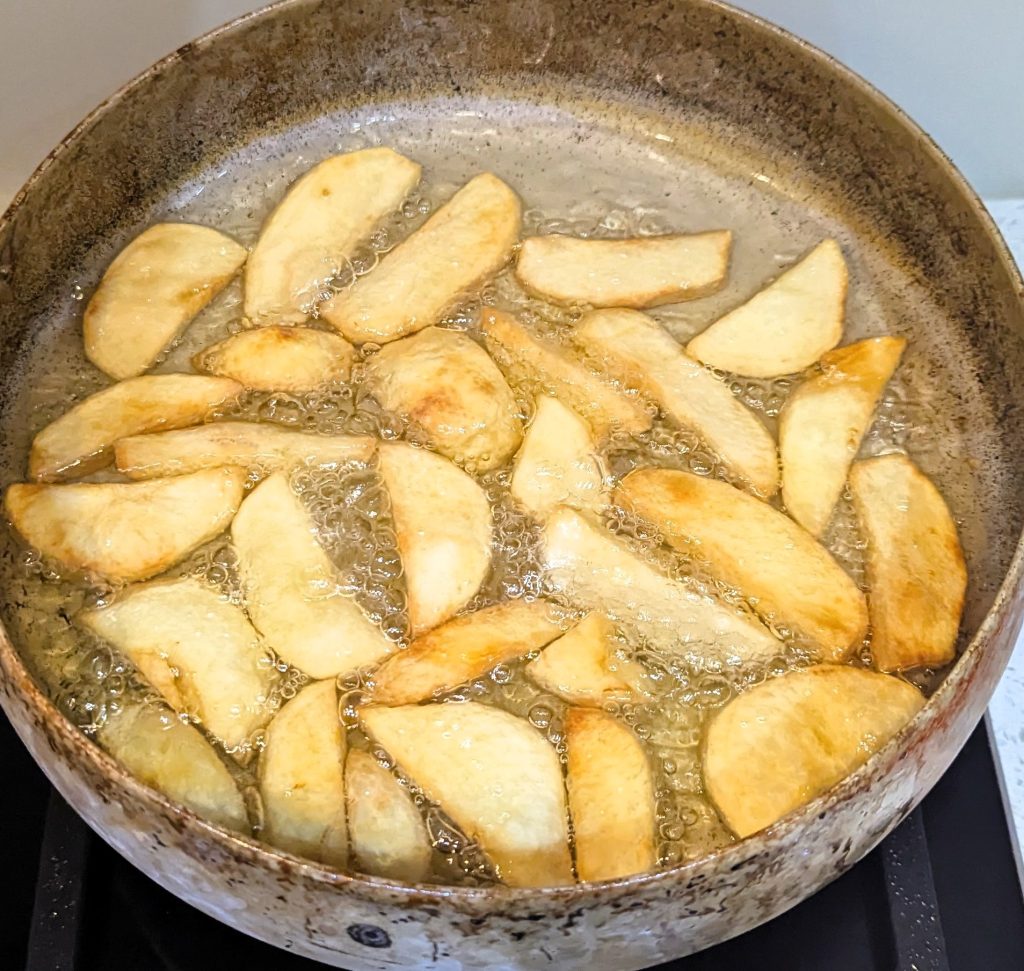 a frying pan with french fries