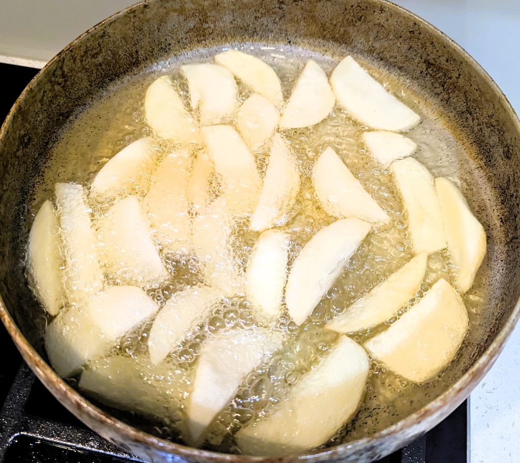 a frying pan with french fries